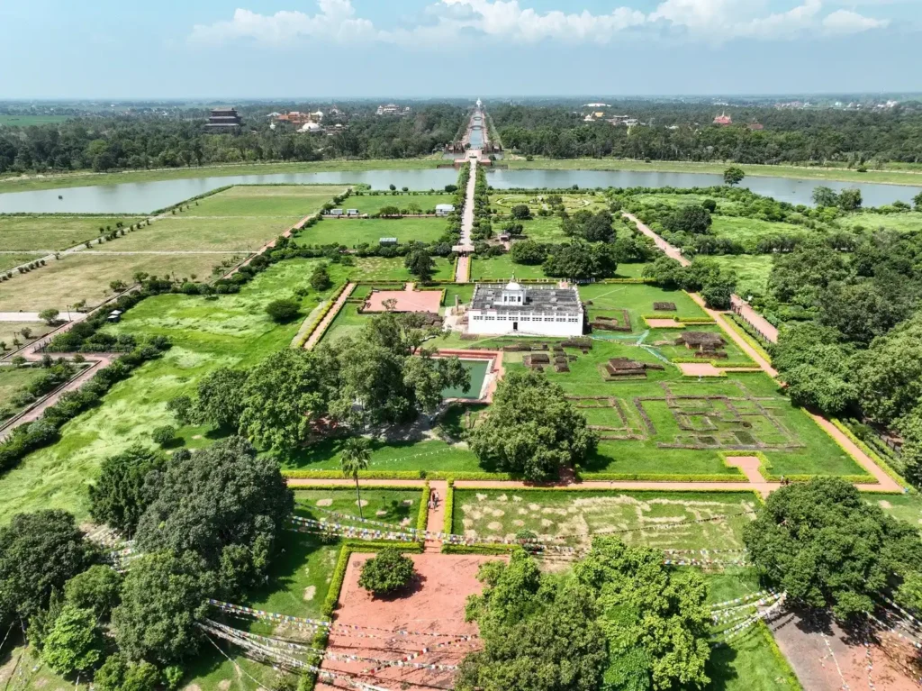drone view of the lumbini complex in nepal with mayadevi temple and lake