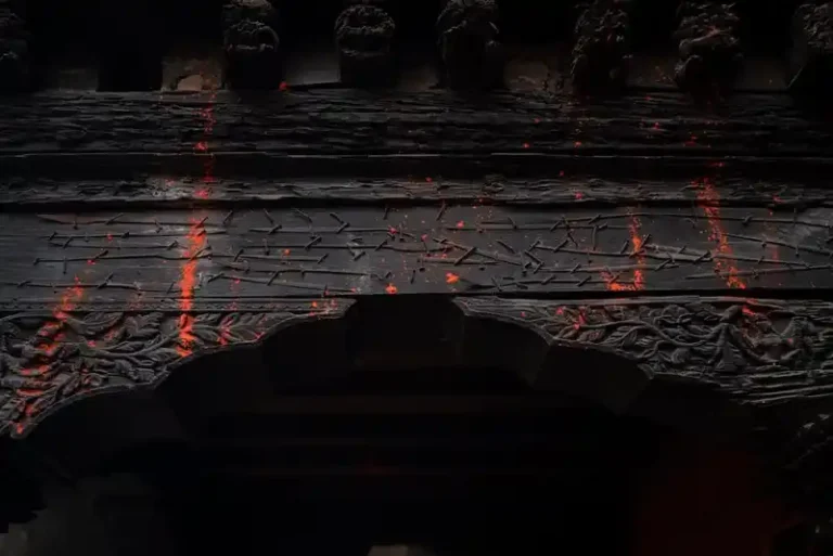 Ritual markings on Bode temple wood during the Biska Jatra festival in Nepal.