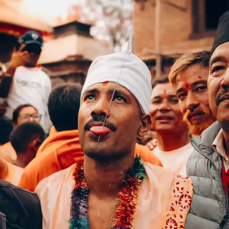 Man in traditional attire during a Nepal cultural festival, possibly Biska Jatra in Bode.