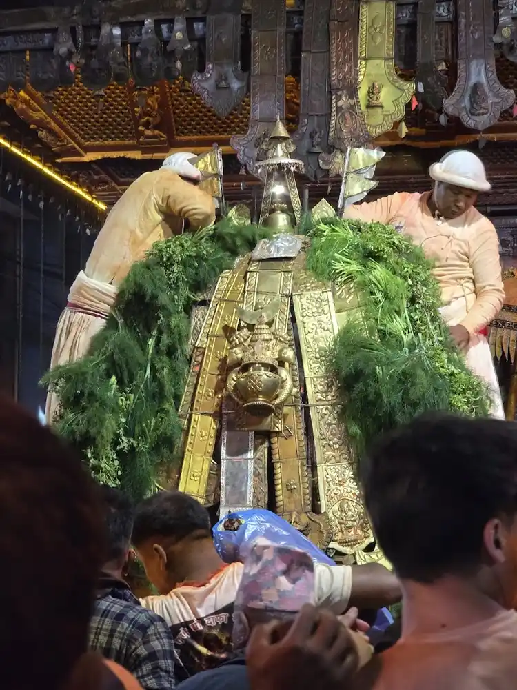 Devotees participate in the Biska Jatra festival, viewing the sacred chariot in Nepal.