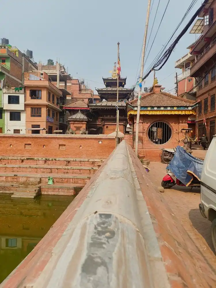 Biska Jatra festival in Nepal, showing the temple and local culture near the sacred pond.
