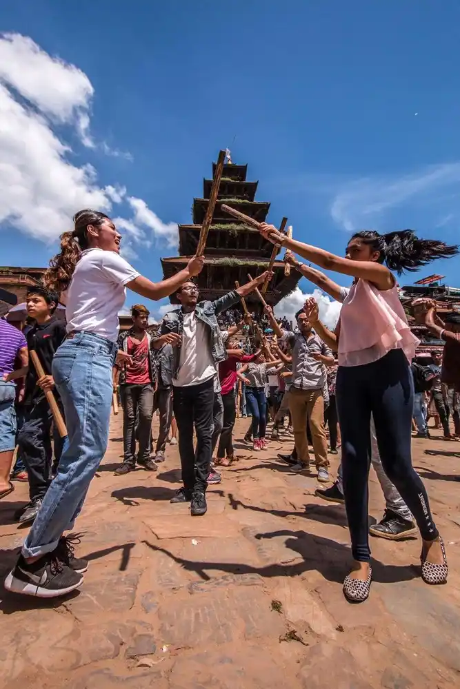 Celebrating Gai Jatra in Bhaktapur, Nepal, during the traditional Ghinting Ghisi procession.