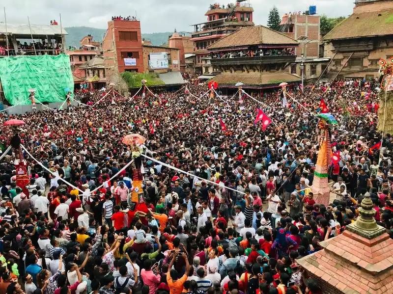 Crowd at a Nepal cultural festival, likely Gai Jatra in Bhaktapur, Nepal.