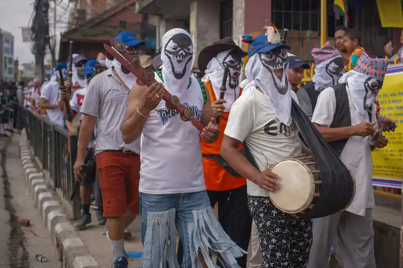 Masks and costumes during the vibrant Gai Jatra festival in Lalitpur, Nepal.