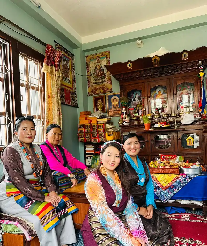 Nepali women celebrating Gyalpo Losar festival in traditional attire.