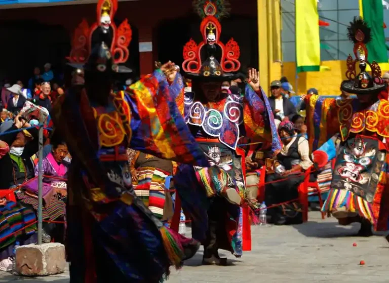 Colorful costumes and masks during a traditional festival celebration in Nepal.