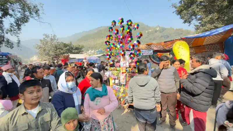 Crowd at a vibrant Nepal festival, celebrating Maghe Sankranti at a local mela.