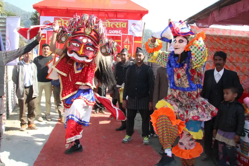 Vibrant mask dance performance during Maghe Sankranti festival in Nepal.