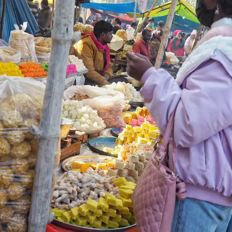 Maghe Sankranti festival market in Bardiya, Nepal, filled with traditional sweets and cultural celebration.