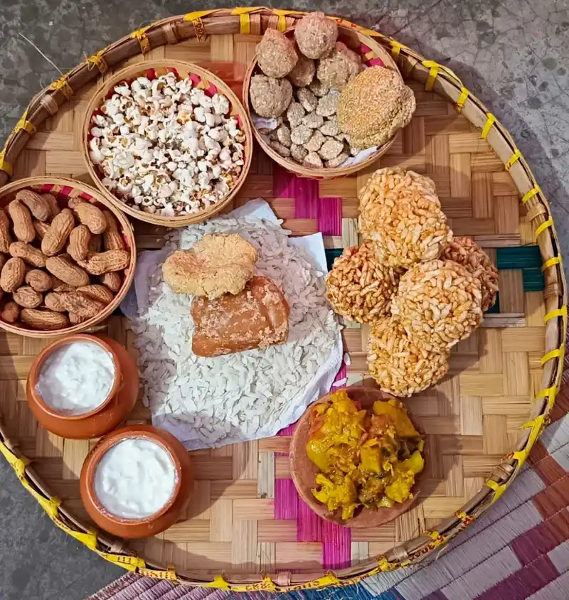 Assortment of festive sweets and snacks for Maghe Sankranti celebration in Nepal.