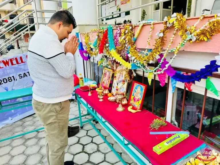 Man praying during Saraswati Puja Basanta Panchami celebration in Nepal.
