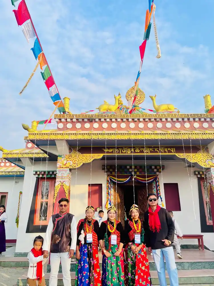 Celebrating Sonam Loshar festival in Nepal with traditional attire at a beautiful temple.