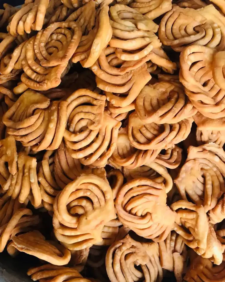 Golden Khapse snacks, a traditional Nepali treat, displayed for Sonam Loshar festival.