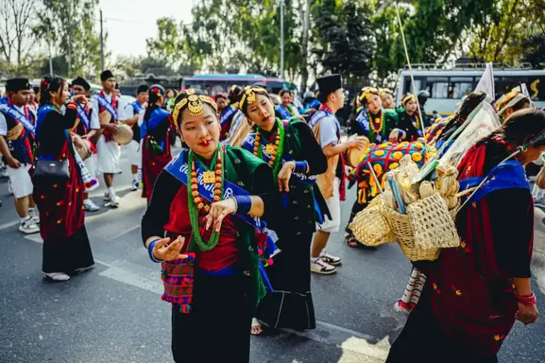 Vibrant Nepali festival procession featuring women in traditional attire during a cultural celebration.
