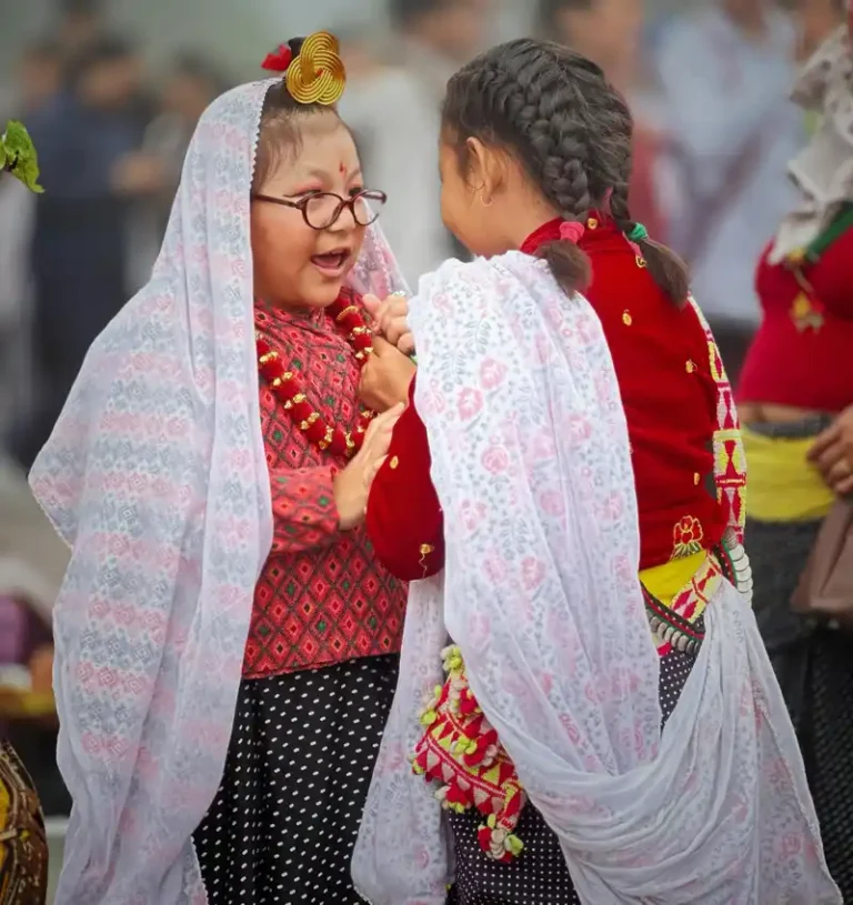 Nepali girls at Udhauli Parva, celebrating Kirat culture in vibrant traditional attire.